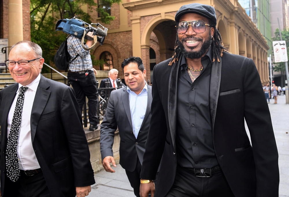 West Indies cricketer Chris Gayle reacts as he leaves the New South Wales Supreme Court after winning a defamation case against an Australian media company in Sydney, Australia, October 30, 2017. AAP/Brendan Esposito/via REUTERS 
