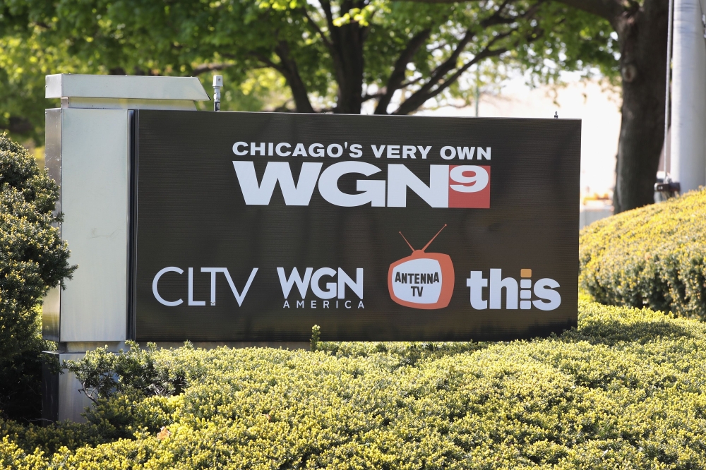In this file photo taken on May 07, 2017, a sign sits outside the studio of Tribune Media Company's, WGN television studio in Chicago, Illinois. AFP /Getty Images North America/Scott Olson 