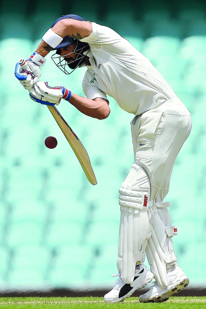 India's batsman Virat Kohli plays a defensive shot on the second day of the tour match against Cricket Australia XI at the SCG in Sydney on November 29, 2018. AFP / Peter Parks