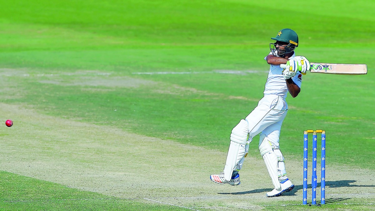 Pakistani batsman Asad Shafiq plays a shot during the third day of the third and final Test cricket match between Pakistan and New Zealand at the Sheikh Zayed International Cricket Stadium in Abu Dhabi on December 5, 2018. AFP / Aamir Qureshi
