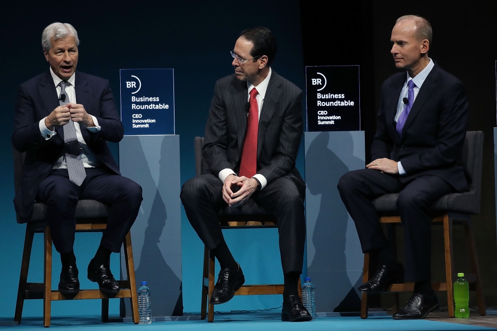  Jamie Dimon, chairman and CEO of JPMorgan Chase, Randall Stephenson, chairman and CEO of AT&T Inc., and Dennis Muilenburg, chairman, president and CEO of the Boeing Company, participate in a business roundtable discussion on 