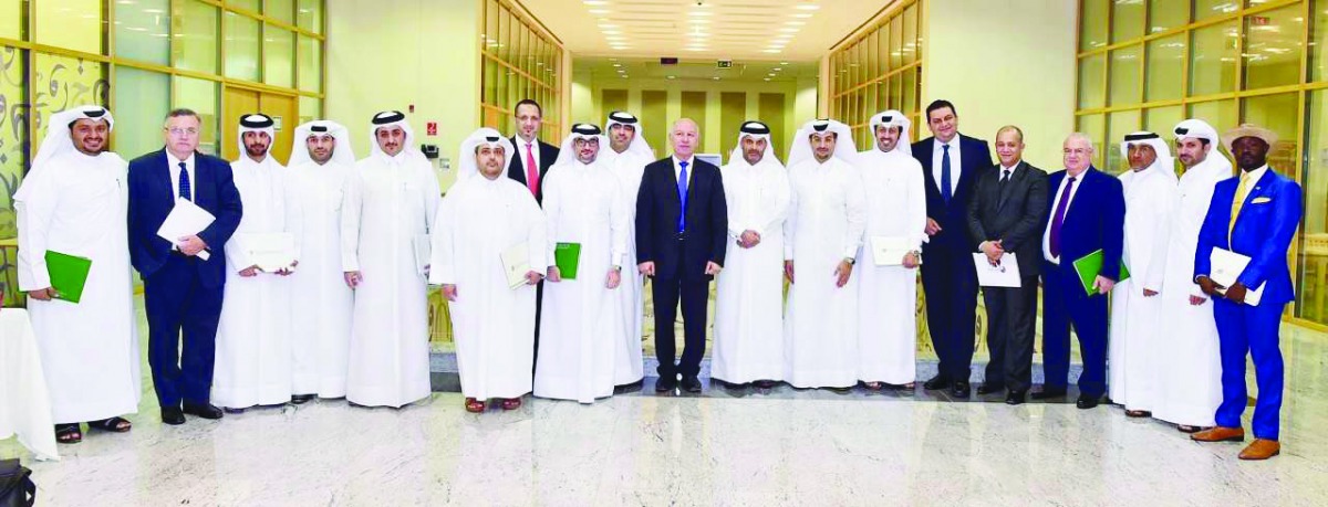 The Qatar International Center for Conciliation and Arbitration officials and the interns during the concluding session of the intership program.