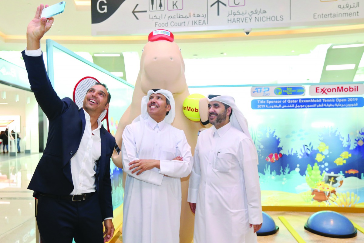 Karim Alami, Tournament Director of Qatar ExxonMobil Open takes a selfie with Saleh Al Mana (centre), Vice President and Director of Government and Public Affairs for ExxonMobil Qatar and Tareq Zeinal, General Coordinator of Qatar ExxonMobil Open in Doha 