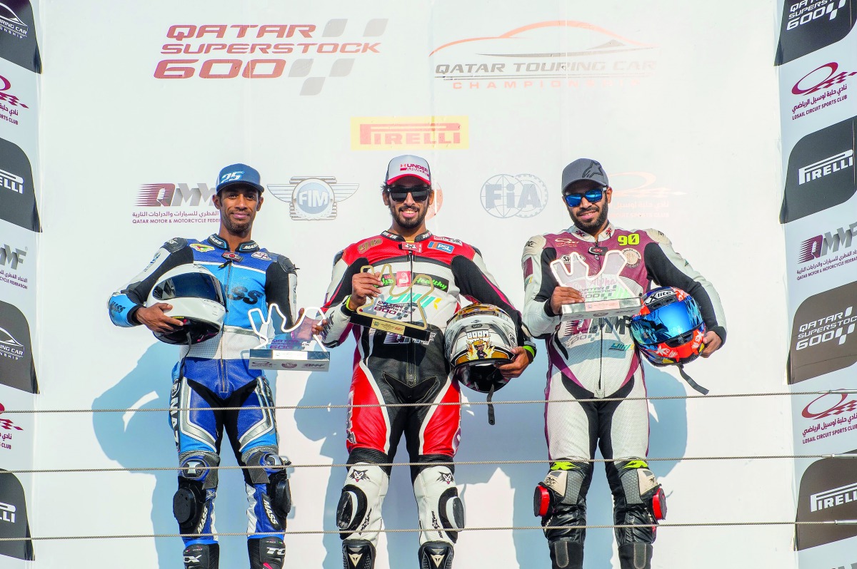 The podium winners of the QSTK Trophy race 1 and 2, Qatari riders Jassim Al Thani, Hassan Al Mansoori and Kuwait’s Mohammad Alzaidan celebrate with their trophies.