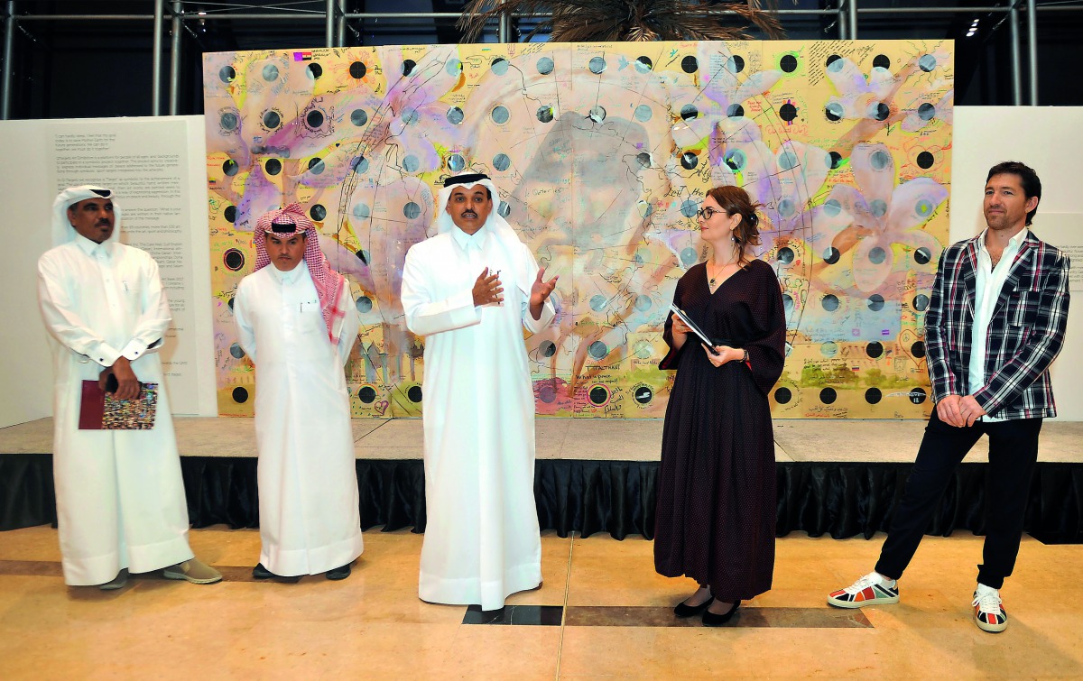 Ali Al Kuwari (centre), President of Qatar Shooting and Archery Federation, with Nadia Chernovil (second right) and Andrii Chernovil (right) at the exhibition. Pic: Abdul Basit / The Peninsula