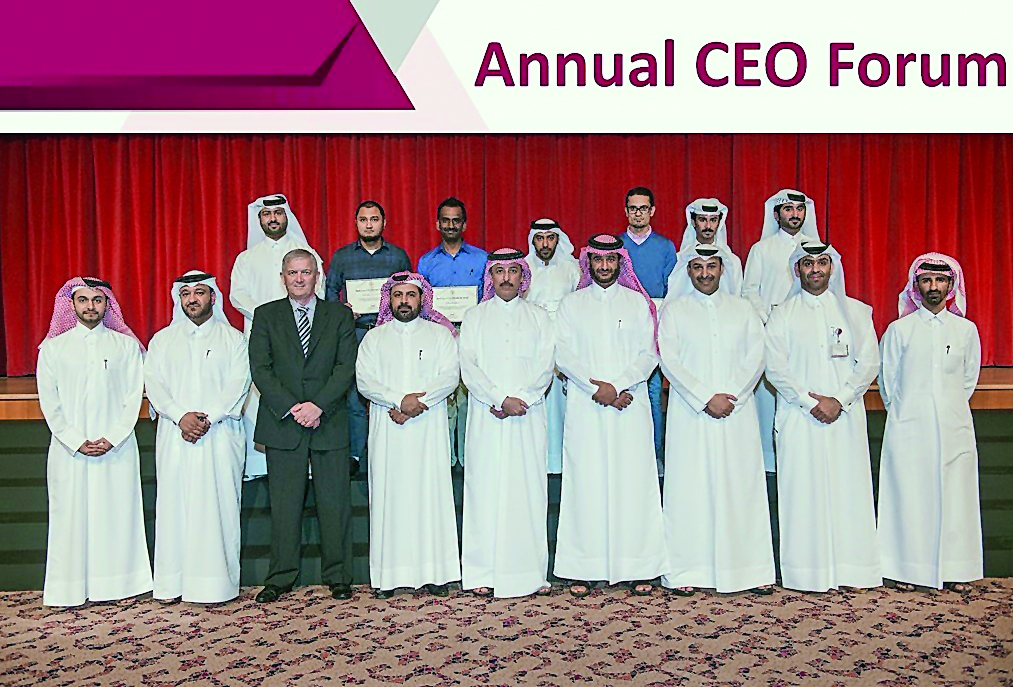 Qatargas National graduates and trainees posing for a picture with the senior management of the company at the CEO Forum 2018.