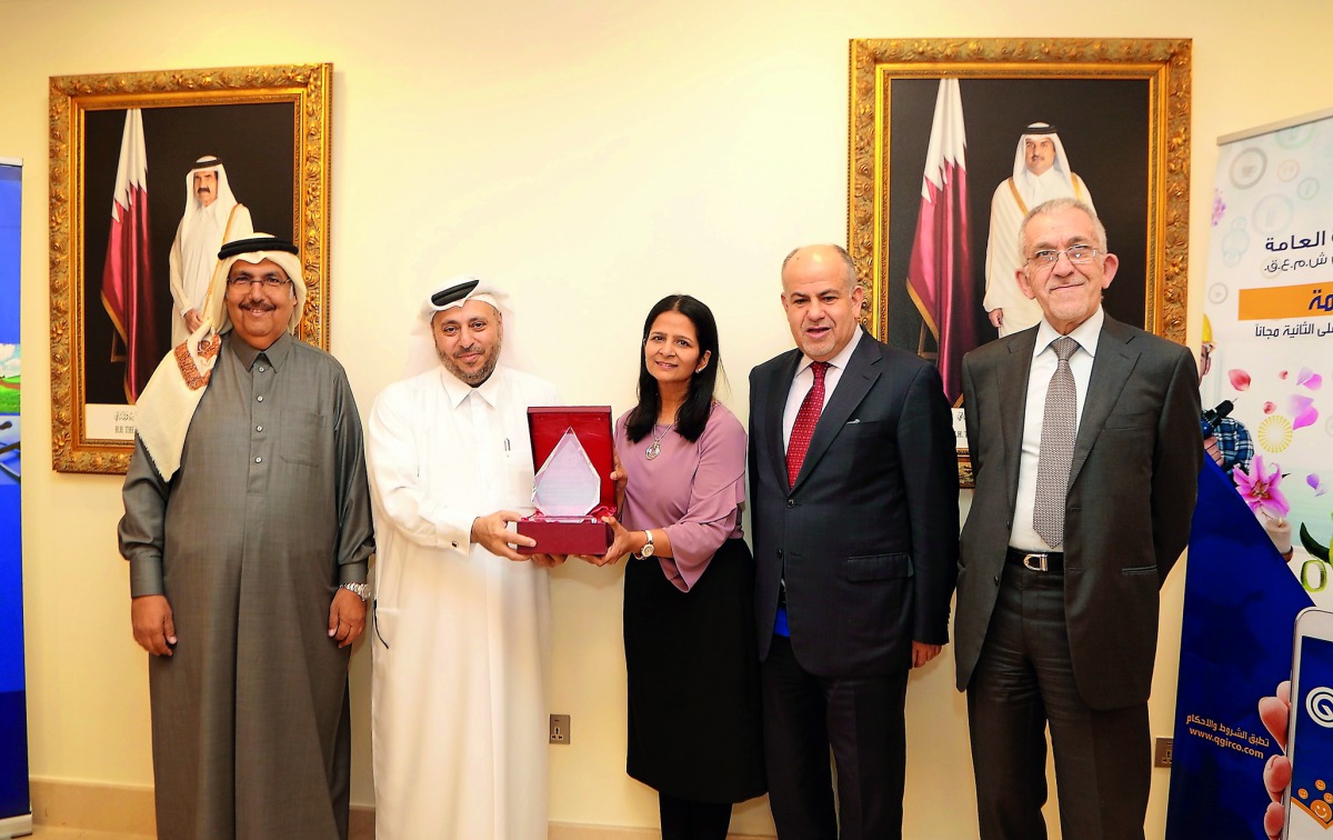 Sheikh Nasser bin Ali bin Saud Al Thani (second left), Chairman and Managing Director of Qatar General Insurance and Reinsurance Company (QGIRC), honouring the Acting CFO of QGIRC, Deepa Chandrashekar, on her receiving a doctorate degree in Islamic Financ