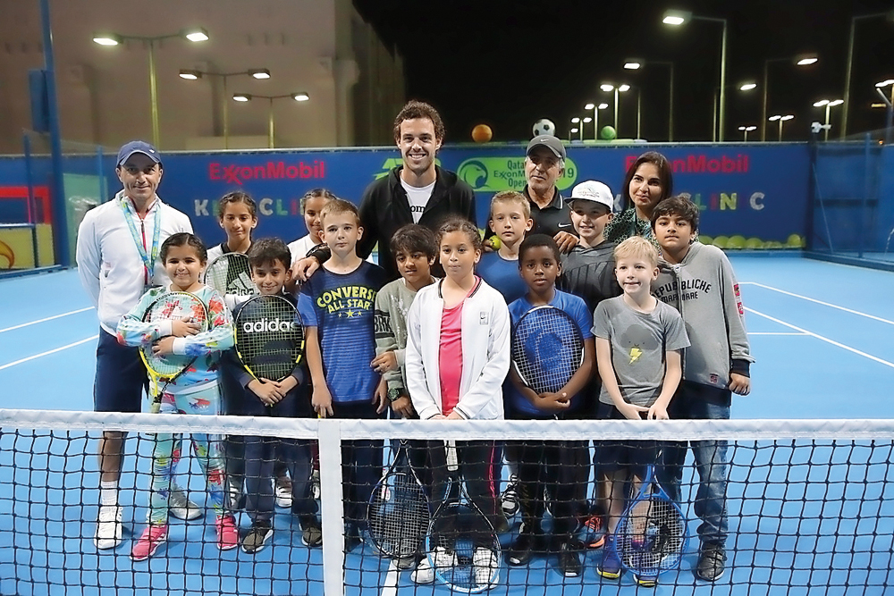  Italian star Marco Cecchinato poses for photograph along with children who took part at a Kids Tennis Clinic in Doha, yesterday. 