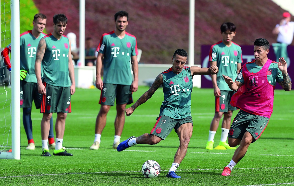 Bayern Munich midfielder Thiago Alcantara (left) takes part in a training session during their winter training camp in Doha yesterday.