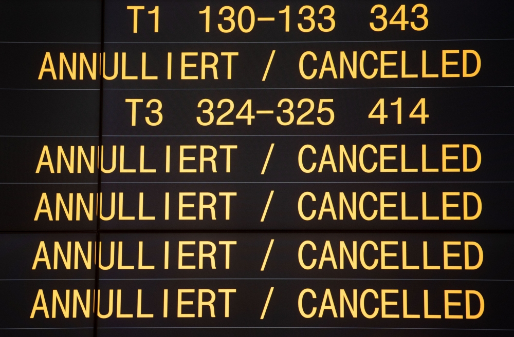 A board displays cancelled flights during a one-day strike by security staff at Stuttgart's airport on January 10, 2019.  AFP / dpa / Marijan Murat
 