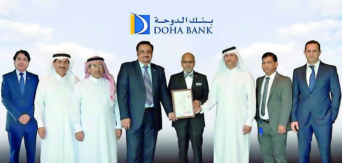 Dr R Seetharaman, Group CEO (fifth left), Doha Bank, and other senior officials with the award.