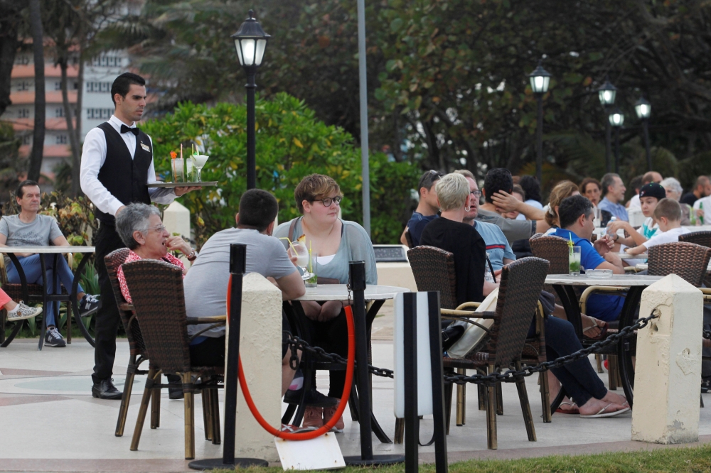 Tourists sit in the garden of a hotel in Havana, January 29, 2018. Reuters