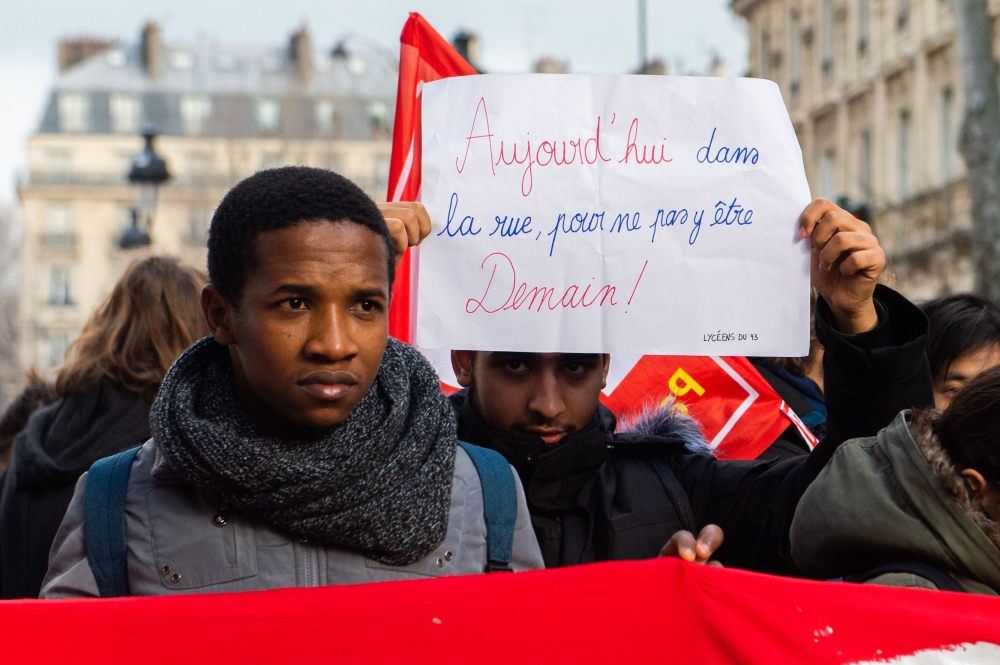 Students hold banners reading Today in the street not to end up there tomorrow on December 11, 2018 in Paris, during a demonstration against the French education system reforms (AFP) 