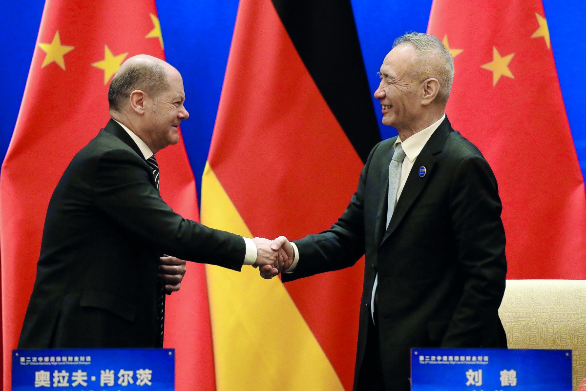 German Finance Minister Olaf Scholz shakes hands with Chinese Vice Premier Liu He after attending a signing ceremony for the China-Germany High Level Financial Dialogue at the Diaoyutai State Guesthouse in Beijing, China, January 18, 2019. Andy Wong/Pool 