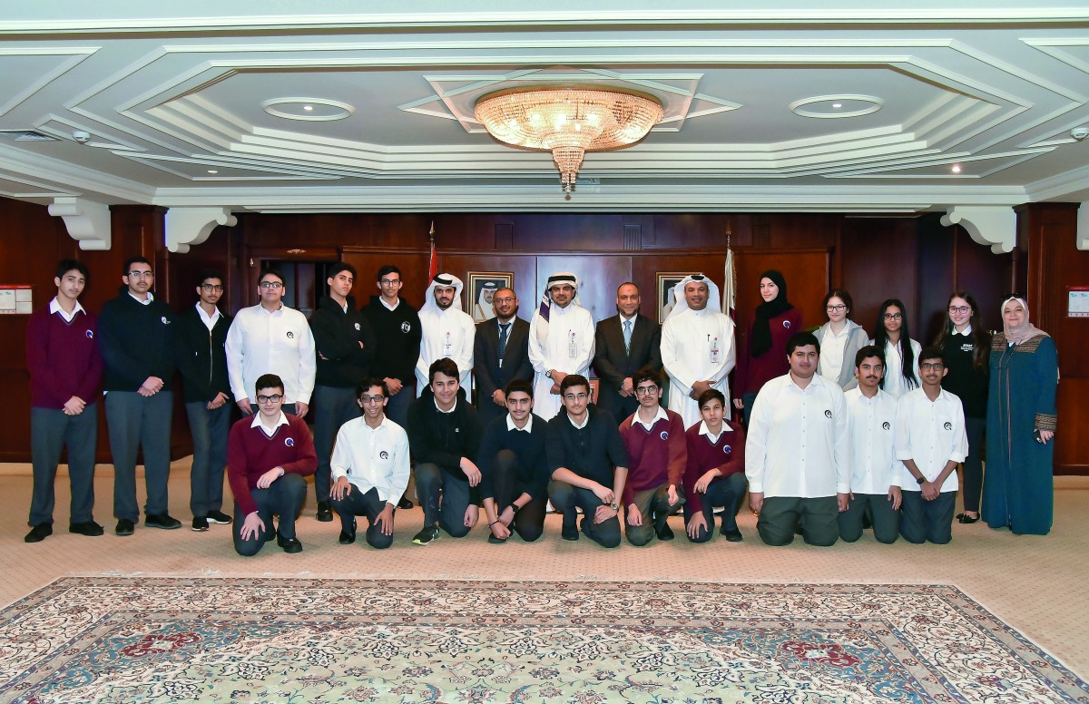 QIIB Chief Executive Officer Dr Abdulbasit Ahmad Al Shaibei and other bank officials with the visiting Qatar Academy students.