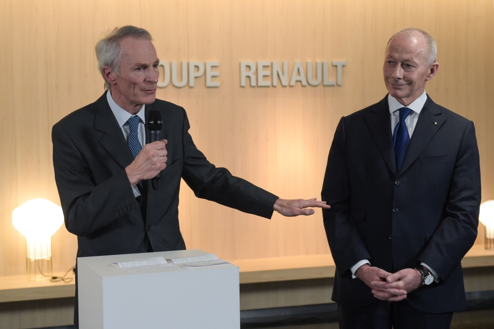 French carmaker Renault's newly appointed board chairman Jean-Dominique Senard (L) delivers a speech next to new chief executive Thierry Bollore during a press conference at the headquarters of the French car manufacturer Renault in Boulogne Billancourt, 