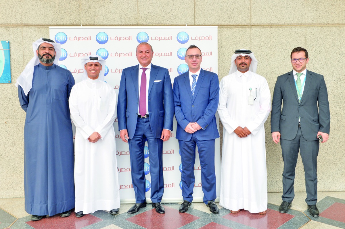 Bassel Gamal (third left), QIB Group’s CEO; and other QIB senior executives on the sidelines of the event.