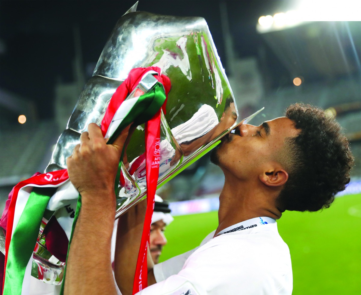 Man-of-the-match, Akram Afif kisses the AFC Asian Cup trophy after Qatar’s historic title win in Abu Dhabi, on Friday. 