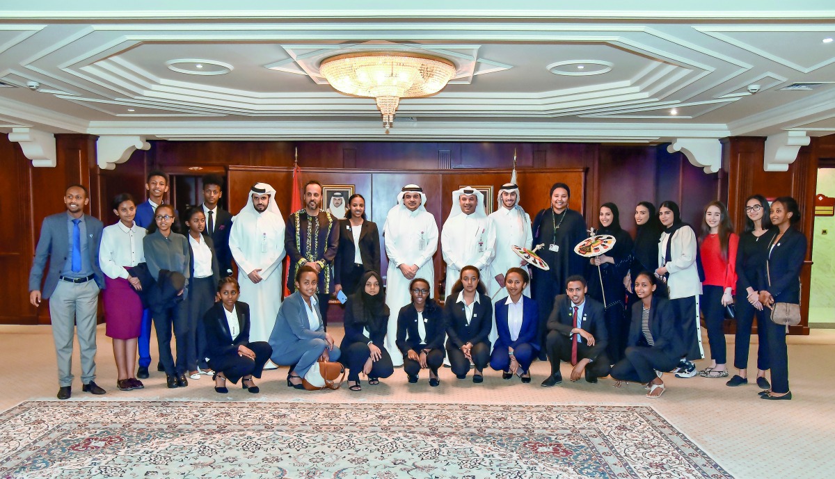 Dr Abdulbasit Ahmad Al Shaibei (centre), QIIB’s CEO, and other officials posing for a group picture with the Ethiopian students, accompanying teachers and their fellow Qatari students who invited them to the THIMUN Conference, held in Doha, recently.