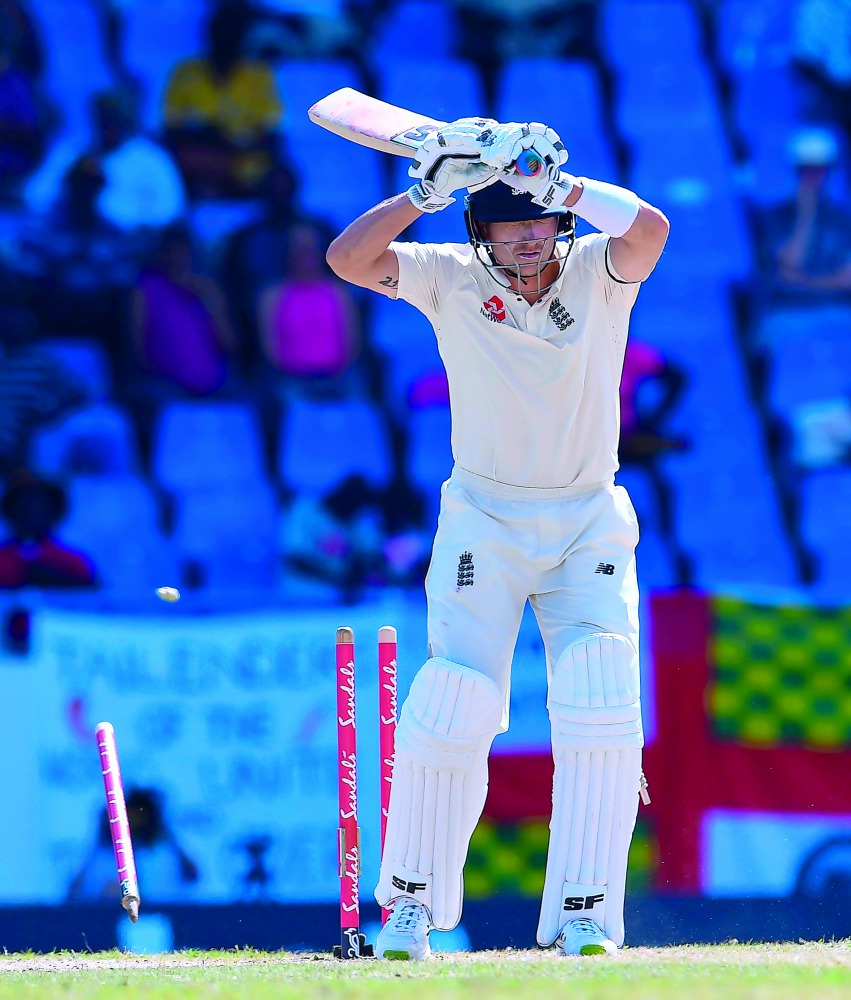 Joe Denly of England is bowled by Alzarri Joseph of West Indies during day 3 of the 2nd Test between West Indies and England at Vivian Richards Cricket Stadium in North Sound, Antigua and Barbuda, on February 02, 2019. AFP / Randy Brooks