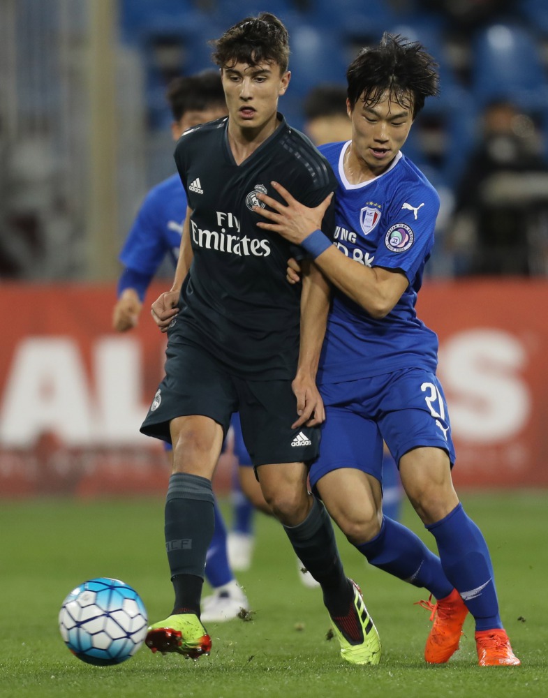 Real Madrid and Suwon Samsung players vie for the ball possession during their Al Kass International Cup match at the Aspire Zone in Doha, yesterday.
