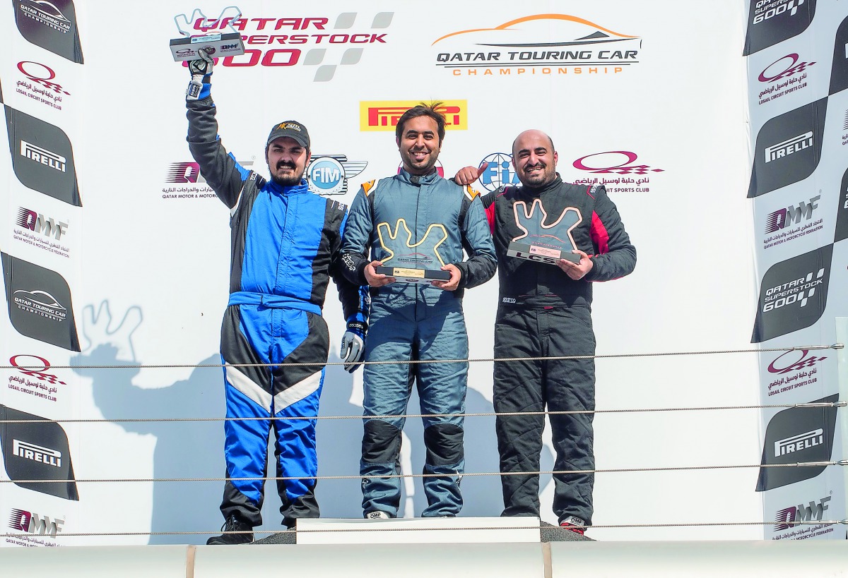 Abdulla Al Khelaifi (centre), Mohamad Al Khaiat (left) and Ahmed Al Asiri pose on the podium after yesterday’s first race.