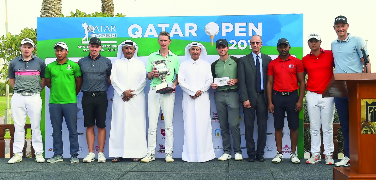 The podium winners at the Qatar Open Amateur Championship pose for a picture along with officials of Qatar Golf Association at Doha Golf Club yesterday. Picture: Syed Omar