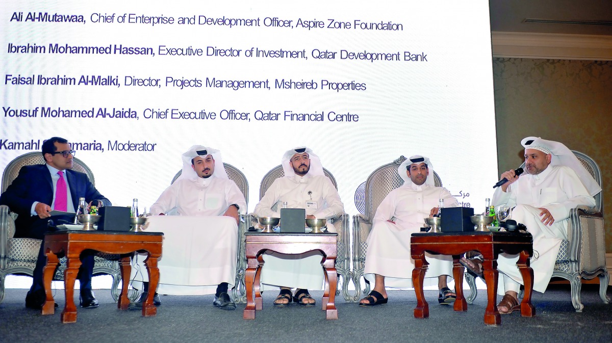 Yousuf Mohamed Al Jaida, (right) Cheif Executive officer of QFC Authority, during the panel discussion held on the sidelines of the unveiling of QFC strategic plan 2022 at Four Seasons Hotel, yesterday. FROM LEFT: Kamahl Santamaria (moderator), Faisal ibr
