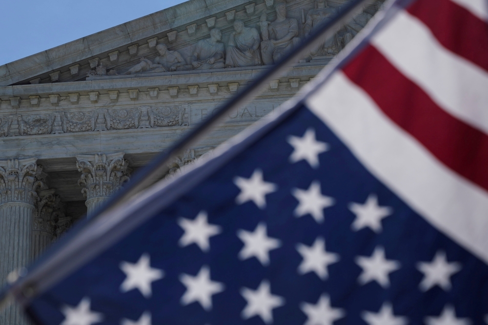 A flag is seen outside the US Supreme Court in Washington, June 25, 2018. Reuters/Toya Sarno Jordan