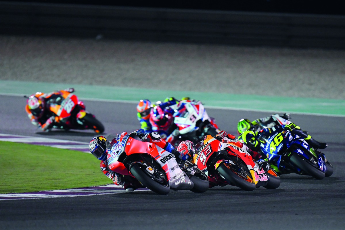 Andrea Dovizioso (left) is closely followed by Marc Marquez and Valentino Rossi in action during the Grand Prix of Qatar at the Losail International Circuit in this file photo.