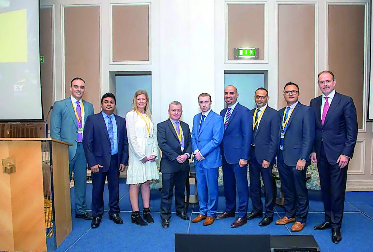 EY tax experts on the sidelines of the conference in Doha.