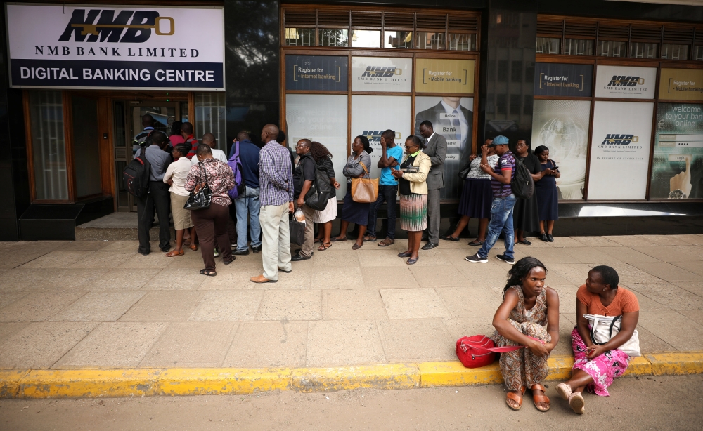 People queue outside a bank in Harare, Zimbabwe February 22, 2019. Reuters/Mike Hutchings 