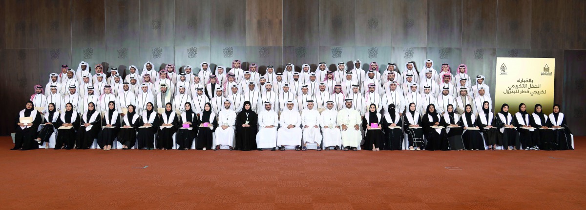 The newly-graduated Qataris with H E Saad bin Sherida Al Kaabi, Minister of State for Energy Affairs, President and CEO of Qatar Petroleum, and other officials during the honouring ceremony. 