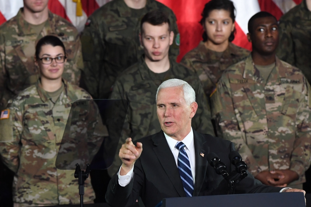 US Vice President Mike Pence delivers a speech at the 1st Airlift Base in Warsaw on February 13, 2019 during a three-day visit of the US Vice President to Poland. AFP/Janek Skarzynski