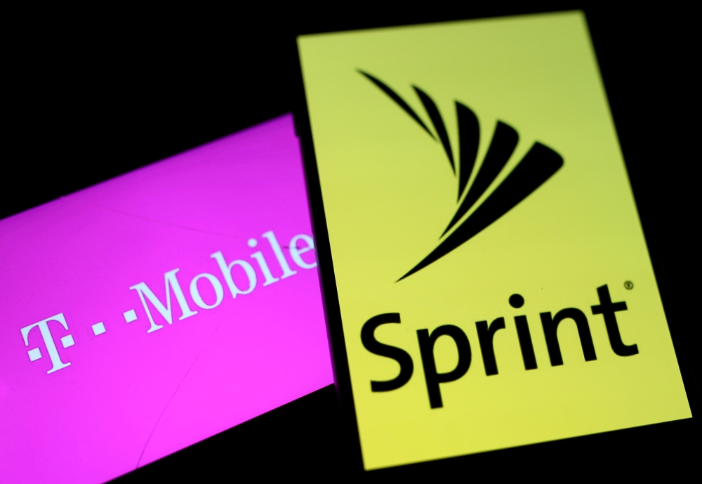 Smartphones with the logos of T-Mobile and Sprint are seen in this illustration taken on September 19, 2017. Reuters/Dado Ruvic