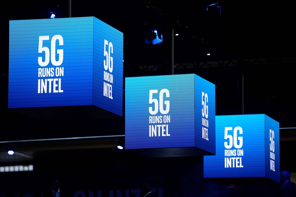 5G signs are displayed at the Intel stand at the Mobile World Congress (MWC) in Barcelona on February 25, 2019.  AFP / Josep Lago 