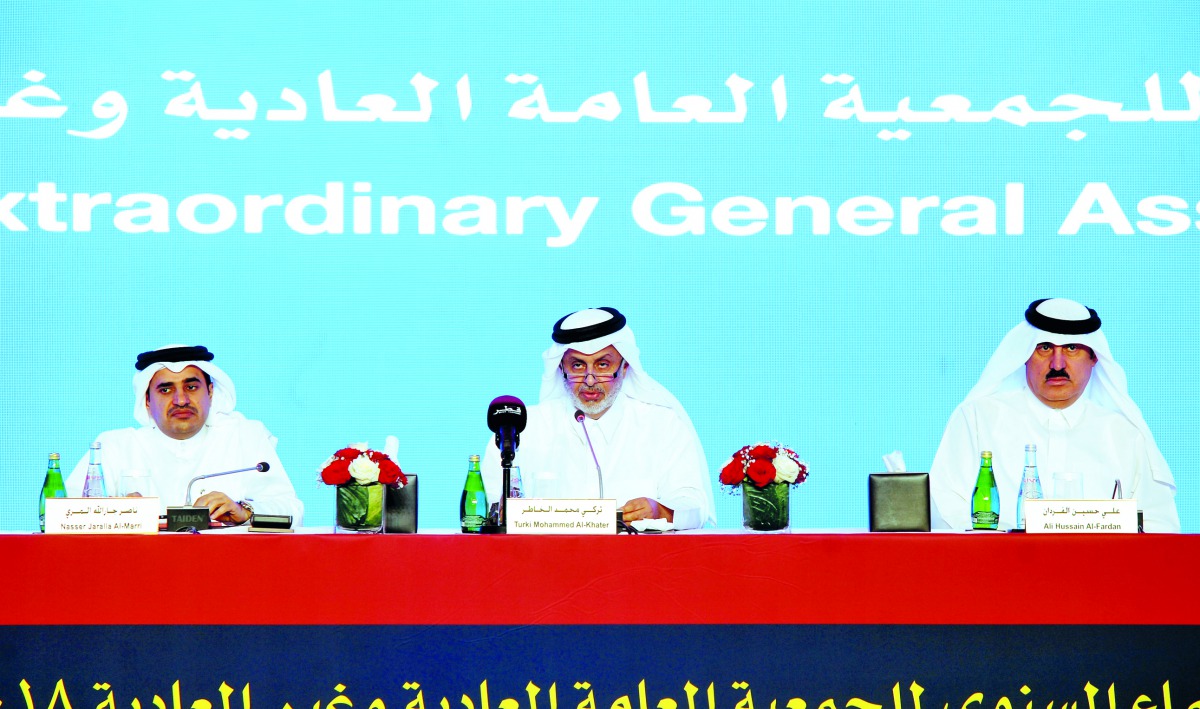 Turki bin Mohammed Al Khater (centre), Chairman of UDC; with Ali Hussain Al Fardan (right), Board member; and Nasser Jaralla Almarri, Board member, during the Ordinary and Extraordinary General Assembly meeting 2018 in Doha, yesterday. Pic: Abdul Basit / 