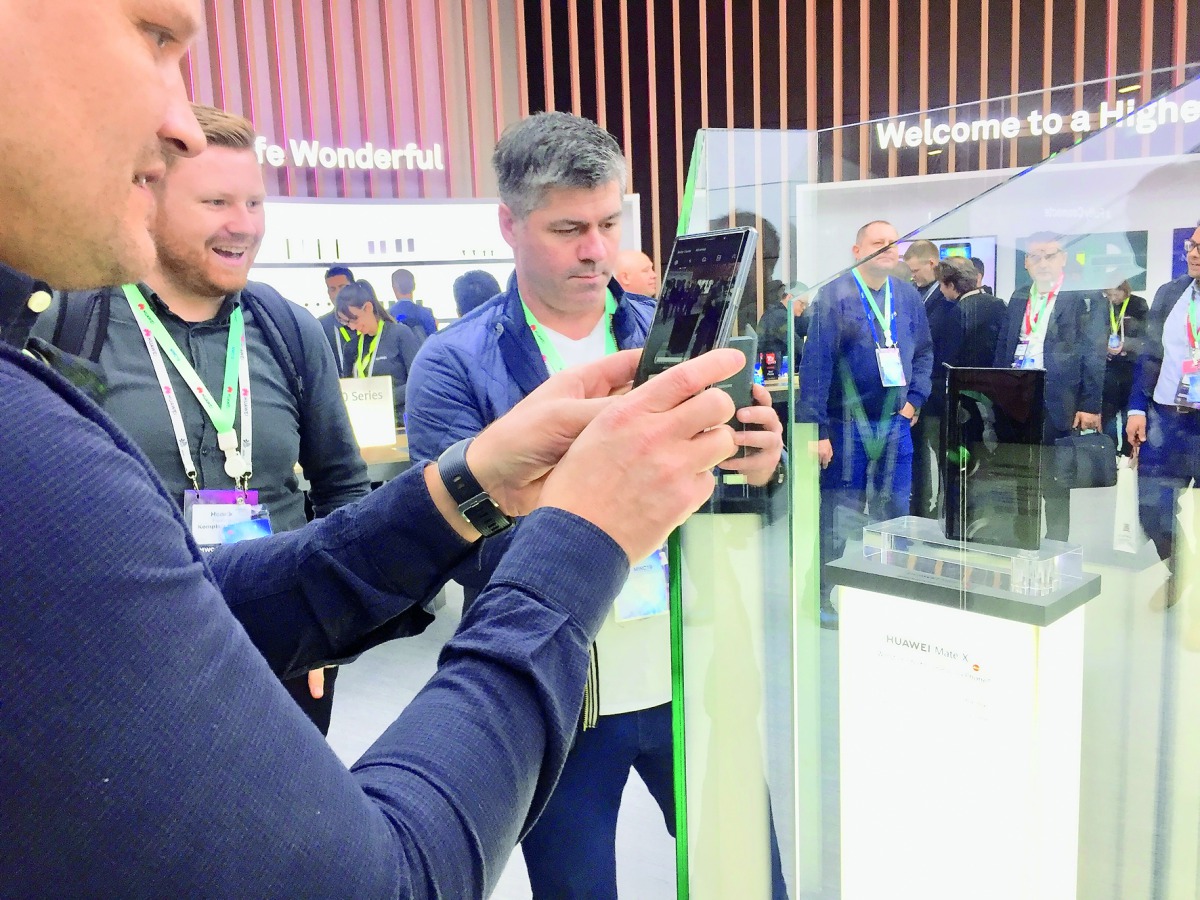 Visitors take photos of recently unveiled Huawei Mate X at Huawei’s main pavilion at the Mobile World Congress 2019 which concludes today. PIC: Raynald C Rivera/The Peninsula