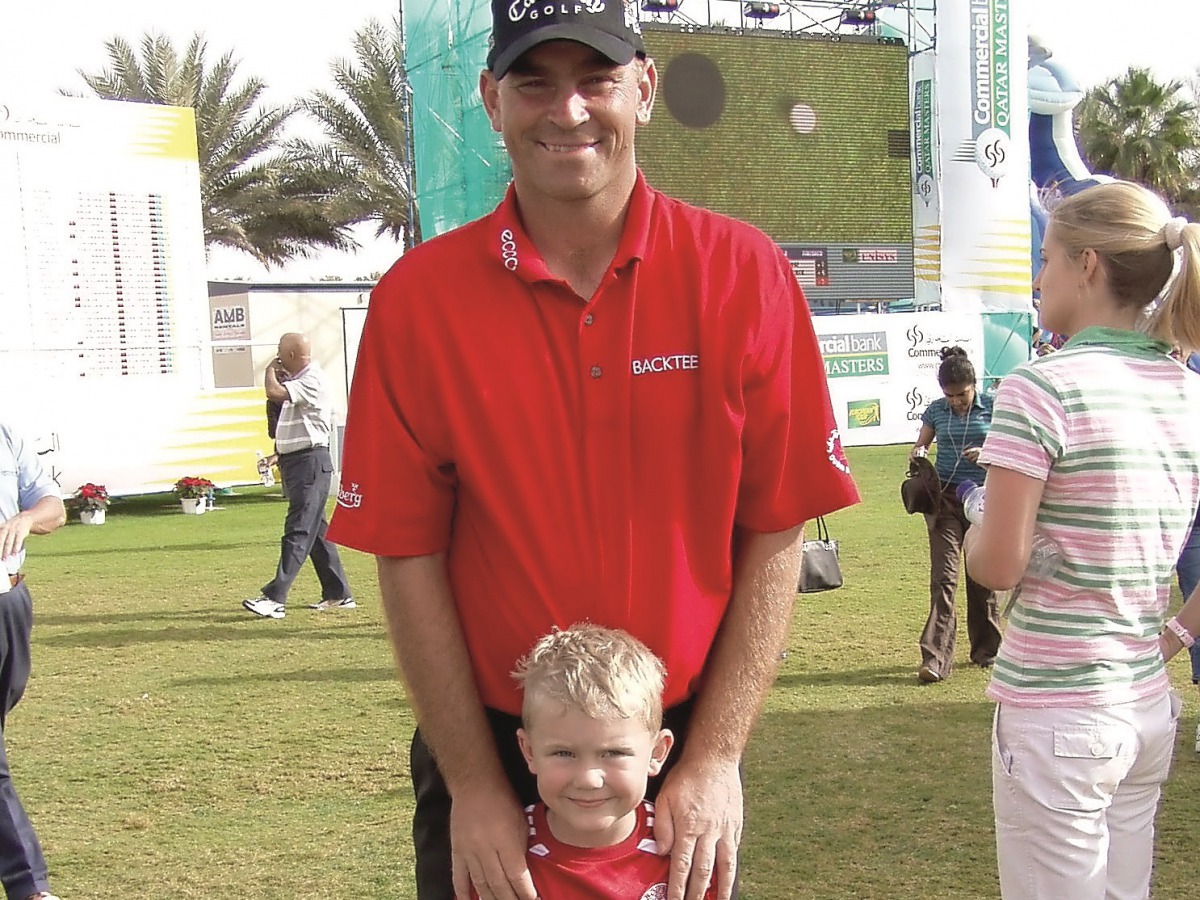 This file photo shows the former victorious Ryder Cup Captain and winner of the 2011 Commercial Bank Qatar Masters, Thomas Bjorn, with the then five-year-old Mikkel Mathiesen, who qualified for the Qatar Masters by winning the Qatar Open earlier this mont