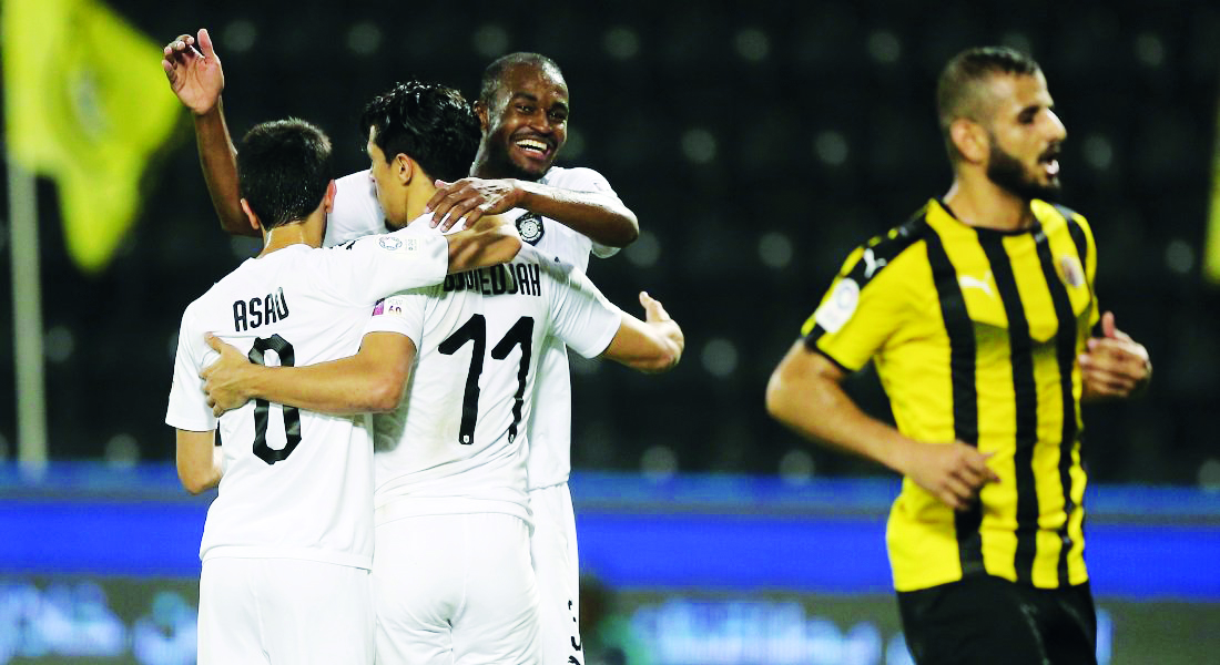 FROM LEFT: Al Sadd’s Ali Asad, Baghdad Bounedjah and Abdelkarim Hassan celebrate after beating Qatar SC 8-1, yesterday.