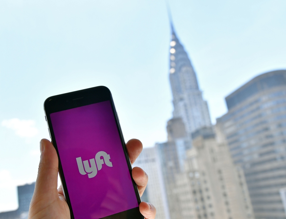 Lyft transport application is seen on a smartphone in New York City in this file photo taken on June 29, 2018.  AFP / Angela Weiss
 