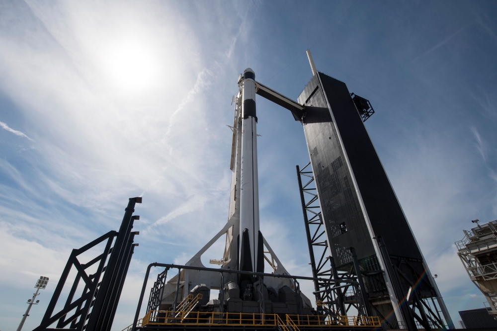 This handout photo released NASA shows a SpaceX Falcon 9 rocket with the company's Crew Dragon spacecraft onboard is seen seen on the launch pad at Launch Complex 39A as preparations continue for the Demo-1 mission on March 1, 2019 at the Kennedy Space Ce