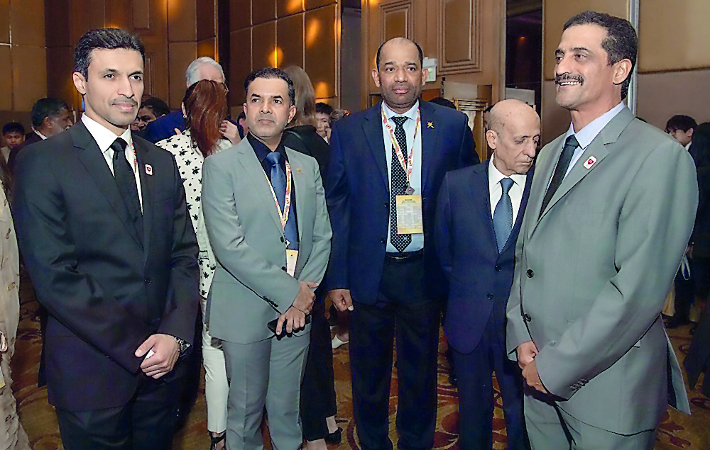 QOC Secretary General Jassim Al Buenain (left) and Director of the QOC Sport Affairs Department Khaleel Al Jabir (right) along with other officials in Bangkok on Saturday.
