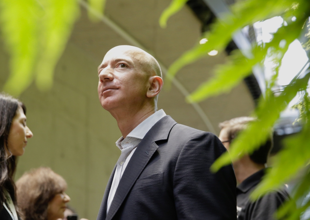 Amazon Chief Executive Officer Jeff Bezos tours the facility at the grand opening of the Amazon Spheres in Seattle in this file photo taken on January 29, 2018. AFP/Jason Redmond