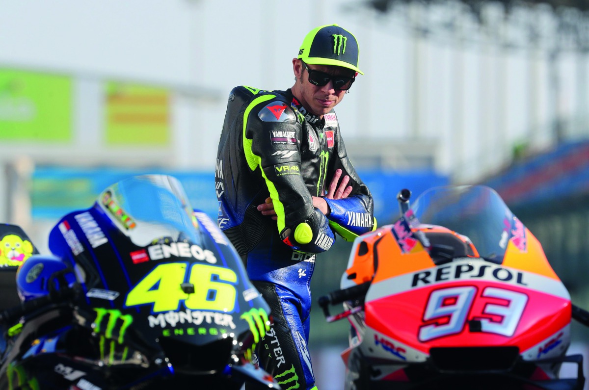 Yamaha MotoGP’s Valentino Rossi looks at his bike.