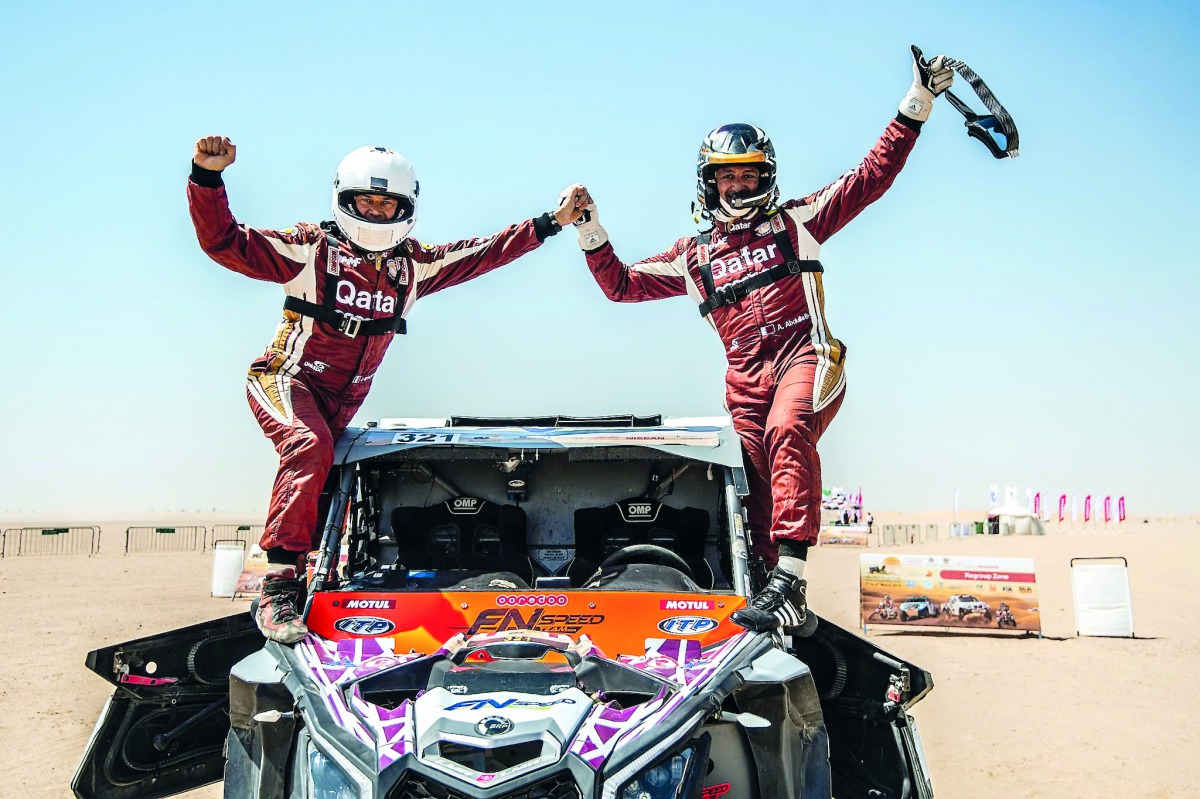 Adel Abdulla (right) and Jean-Michel Polato celebrate their win in Dubai yesterday. 