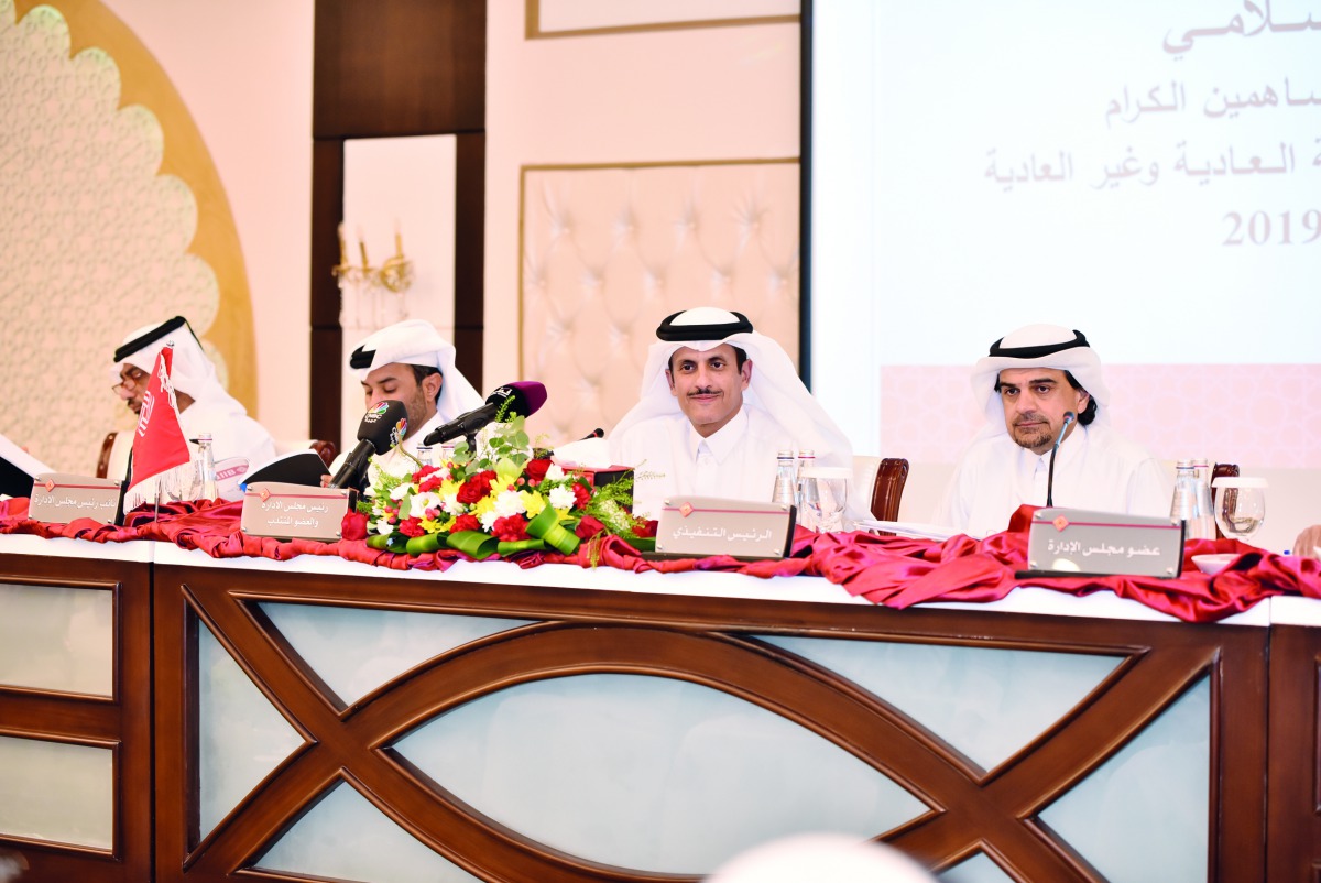 Sheikh Dr. Khalid bin Thani bin Abdullah Al Thani (left), Chairman and Managing Director of QIIB; and  Dr Abdulbasit Ahmad Al Shaibei, Chief Executive Officer of QIIB, during the Annual General Assembly meeting, yesterday.