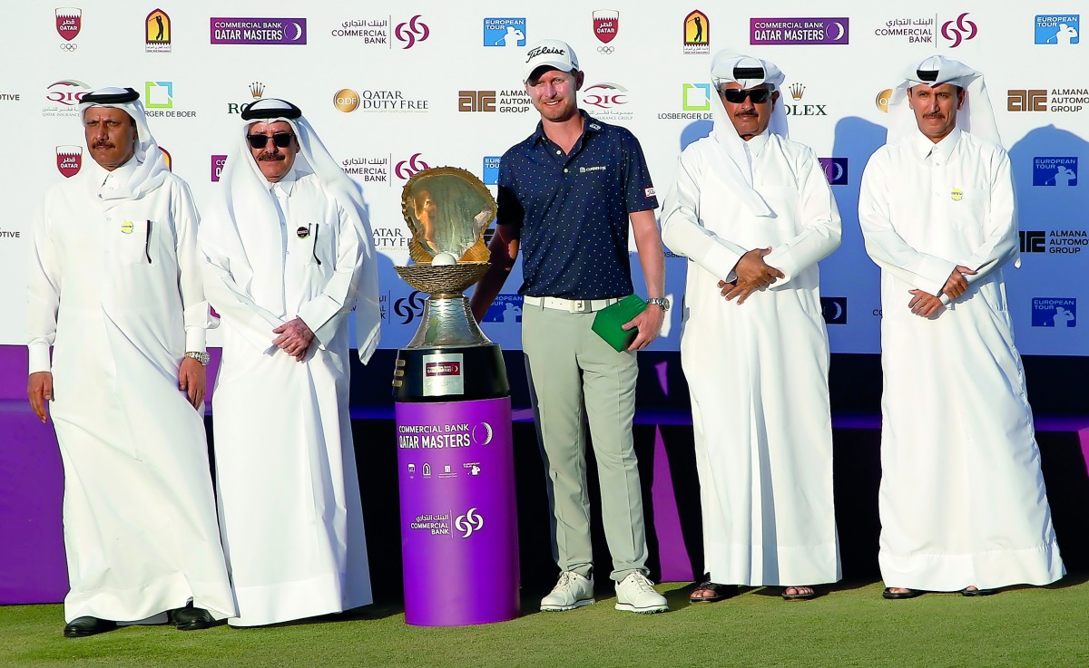 South Africa’s Justin Harding, winner of the Commercial Bank Qatar Masters, poses for a picture with officials of Qatar Golf Association during the presentation ceremony at Doha Golf Club yesterday. 