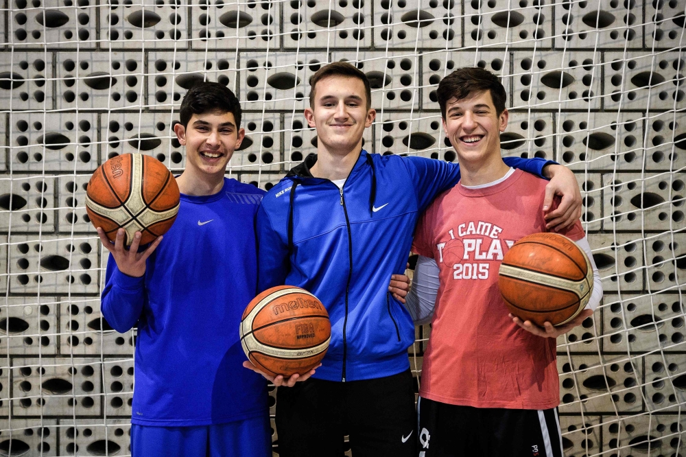 Bernard Murina, 17-year-old Roma, Hevzi Imeri, 17-year-old Albanian and Branislav Prokopijevic, 18-year-old Serbian, pose for a picture during a training session of their basketball club 