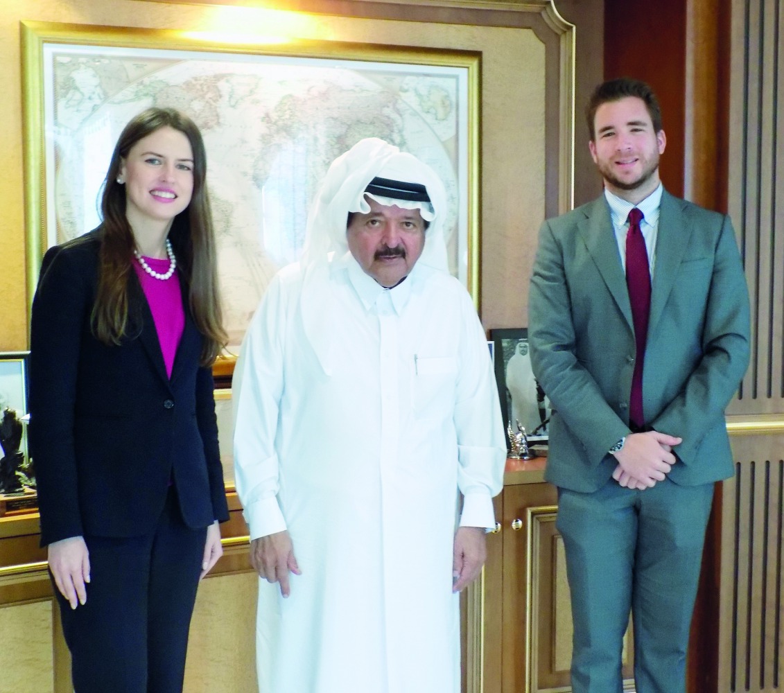 Sheikh Faisal bin Qassim Al Thani, Chairman, Al Faisal Holding, posing for a picture with the representatives of the Oxford Business Group (OBG) after an interview.